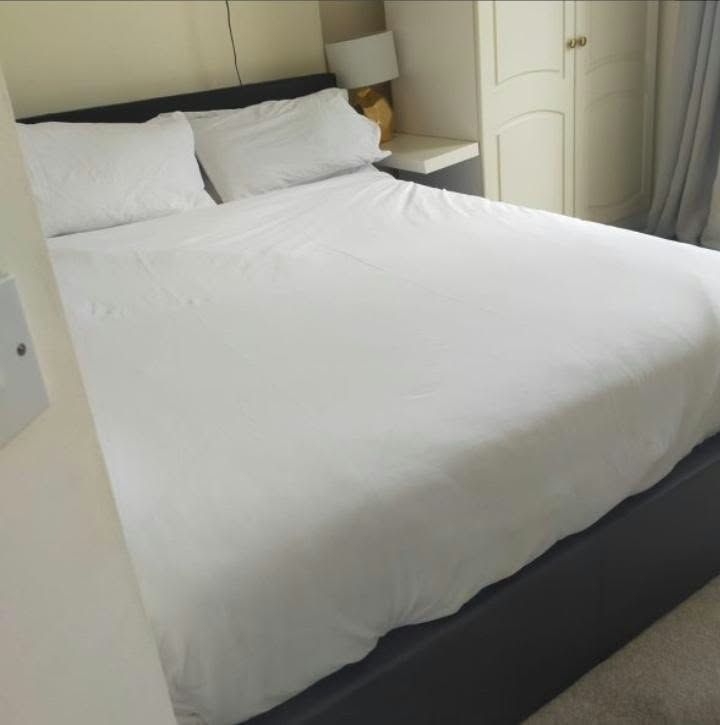 Double bed made up with fresh white linen